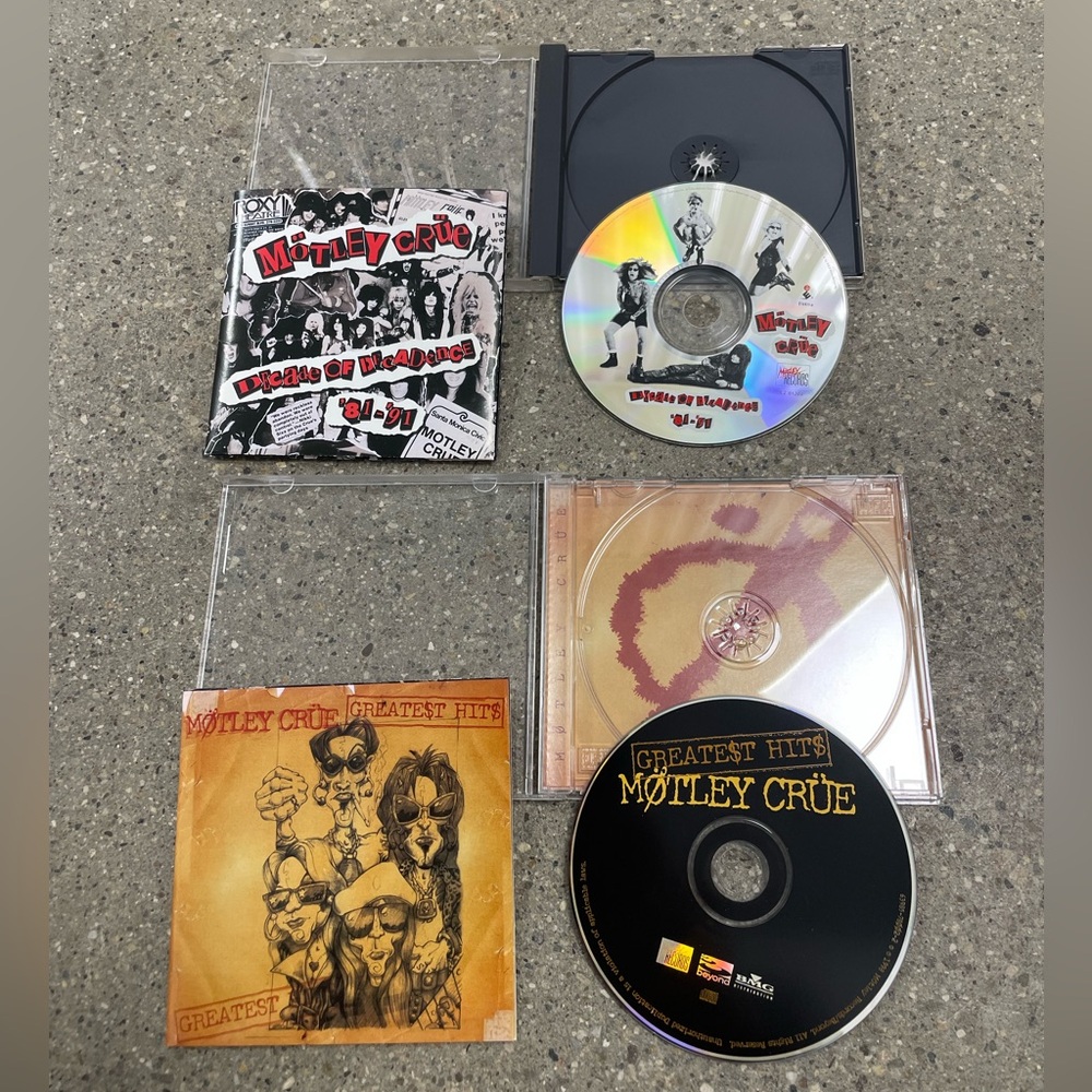 2 vintage Motley Crue CDs with original inserts